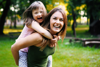 Laughing woman with child