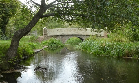 Archers Green bridge over the river mimran with a tree draping over the water's edge, nicely framed over the bridge