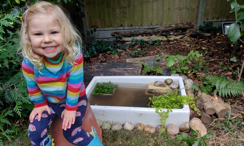 Child by Garden Pond