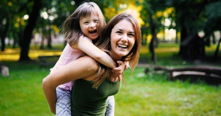 Laughing woman with child