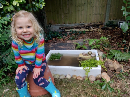 Child by Garden Pond 