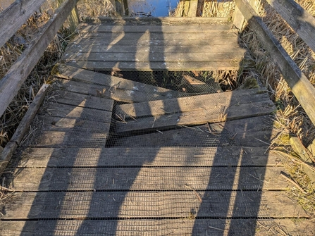Vandalised boardwalk at Purwell Ninesprings Nature Reserve, March 2025