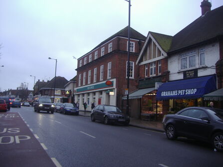 Ruislip shops with road and vehicles