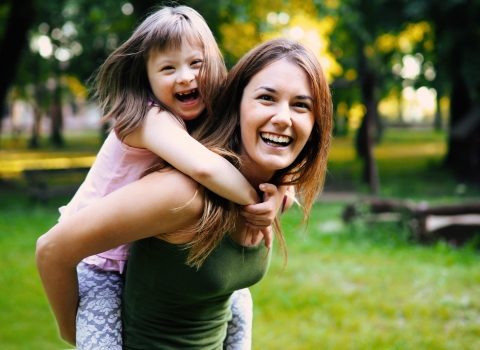 Laughing woman with child