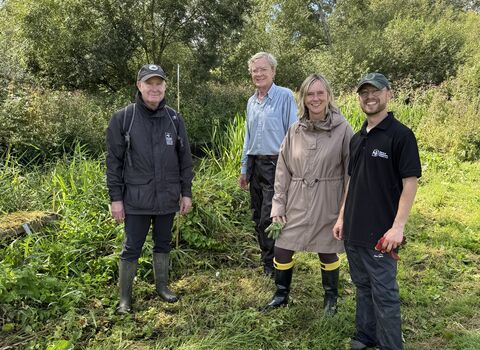 Conservation manager Tim Hill, River Champion Patrick McNeill, Media and PR Officer Debbie Bigg and Water Vole Officer Josh Kalms standing next to the lush banks of the Upper Lea
